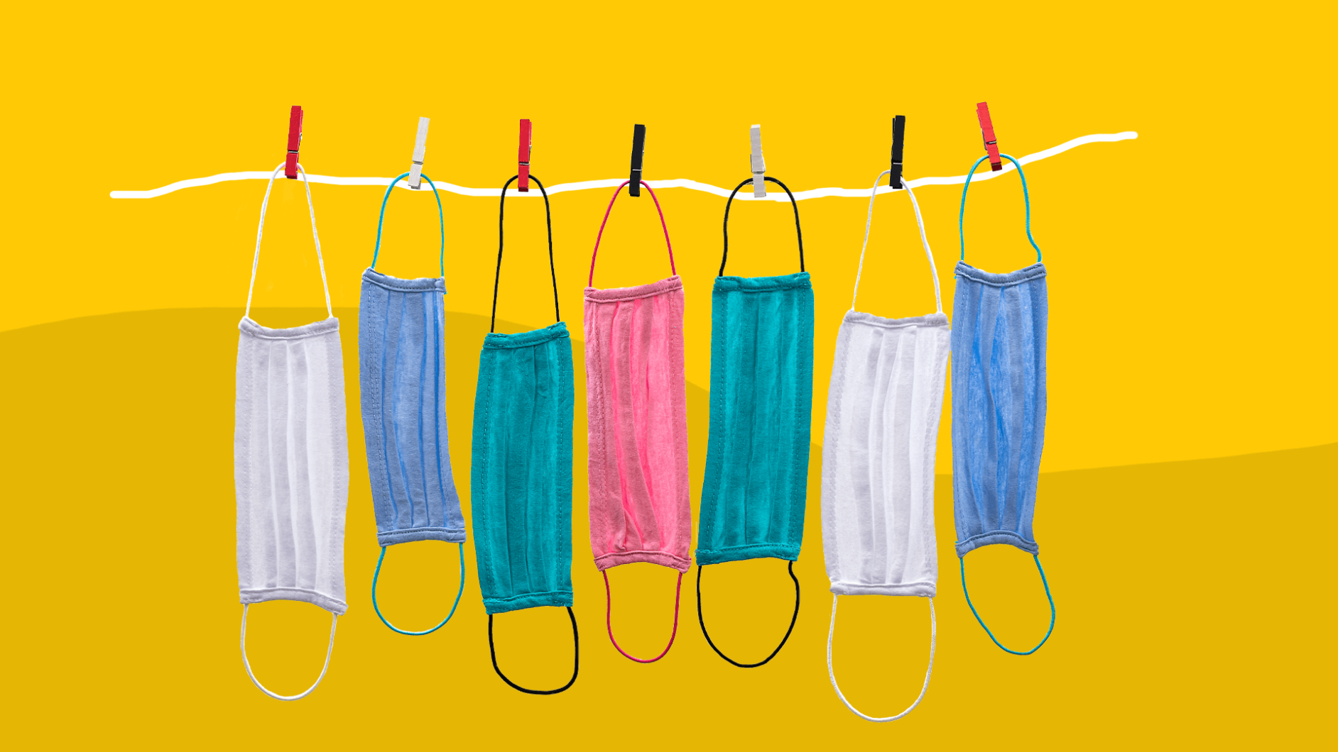 Cloth face masks hanging on a clothesline