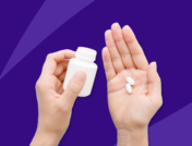 Hand holding Rx pills: Ezetimibe side effects and how to avoid them