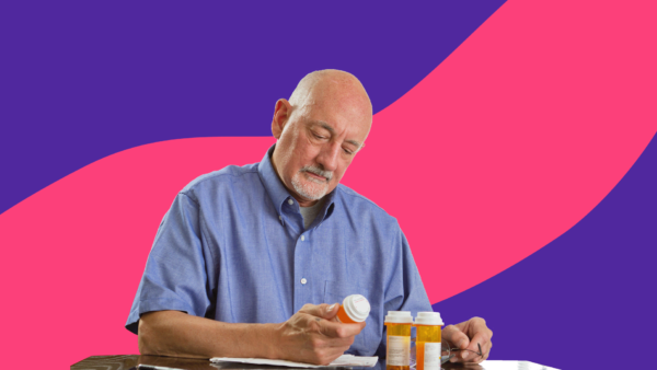 An older man trying to read a medication label