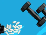 A bottle of pills and free weights | When to take L-carnitine