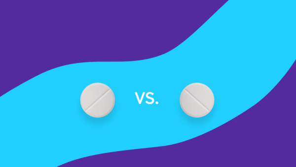 Two round pills with a "vs." between them: Latuda vs. Lamictal: Differences, similarities & side effects