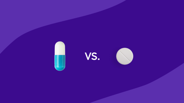 A capsule and a round tablet with "vs." between them: Vraylar vs. Rexulti: Differences, similarities & side effects