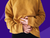 Someon holding their hands over their abdomen: Why does Ozempic cause nausea?