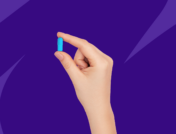 A hand holding a blue Rx capsule: how long does valacyclovir take to work