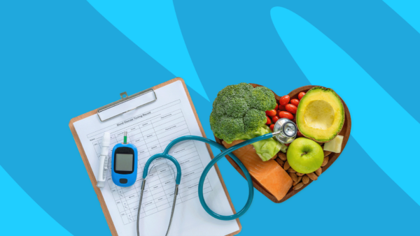 A blood glucose testing record, stethoscope, and bowl of fruits and vegetables shaped as a heart: Does Wegovy help with insulin resistance?