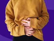 A torso of a person holding their belly: Ozempic sulfur burps and diarrhea