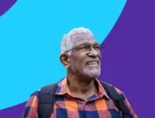 An older man smiling: Explore mental health resources for seniors