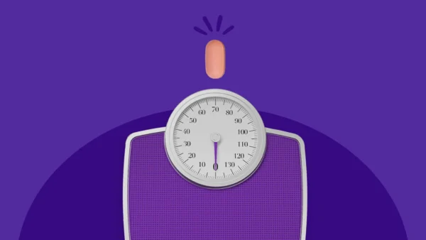 scale next to a tablet - Does pravastatin cause weight gain?